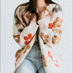 cream beige cardigan with multi colored flowers on it.brand new, no tags though.